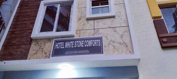 white stone apartments