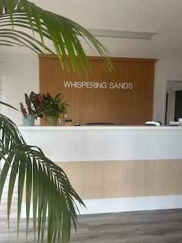 whispering sands beachfront motel