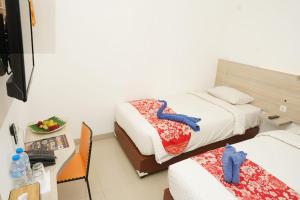 mels inn manado