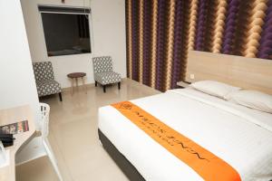 mels inn manado