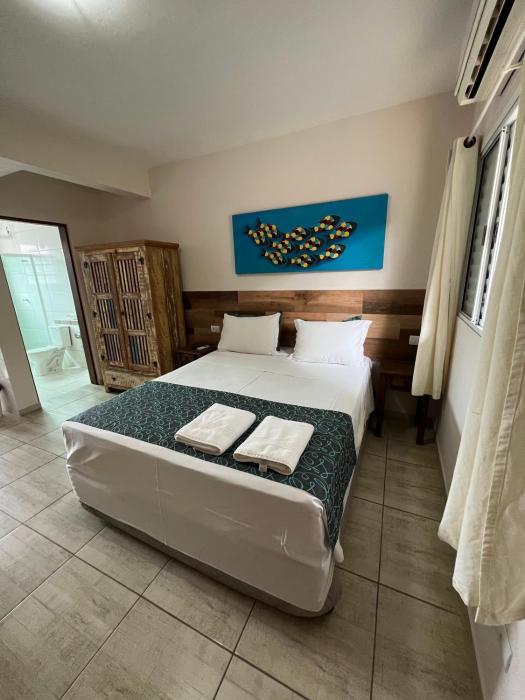 velinn pousada iguana azul