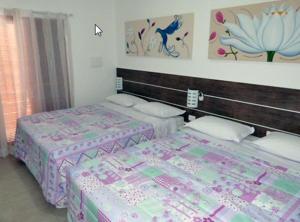 velinn pousada iguana azul