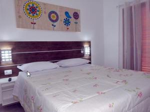 velinn pousada iguana azul