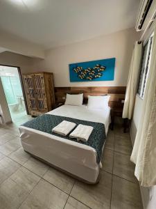 velinn pousada iguana azul