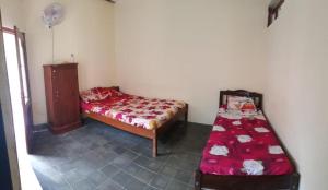 losmen 2000 tiga