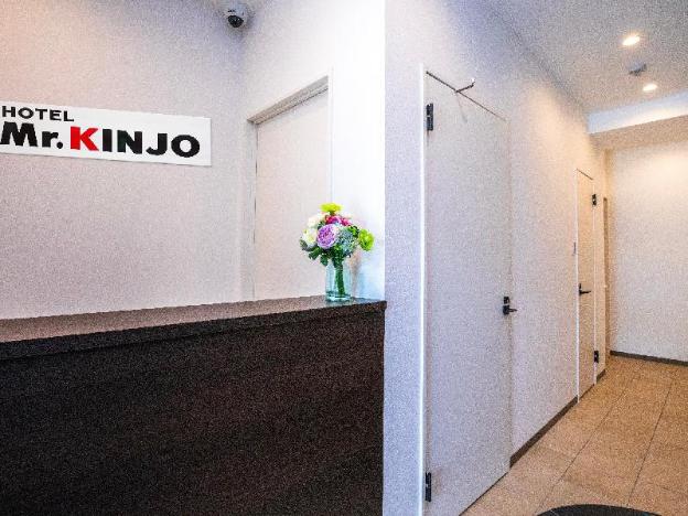 mr kinjo miki24 in front of makishi station