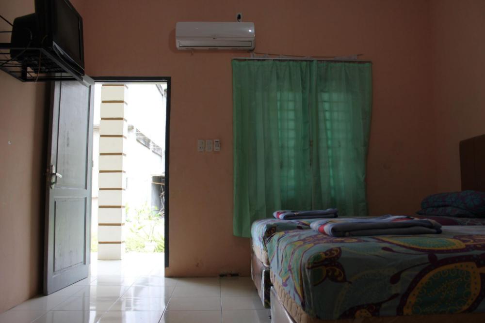 penginapan transit tomato