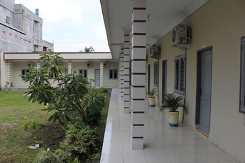 penginapan transit tomato