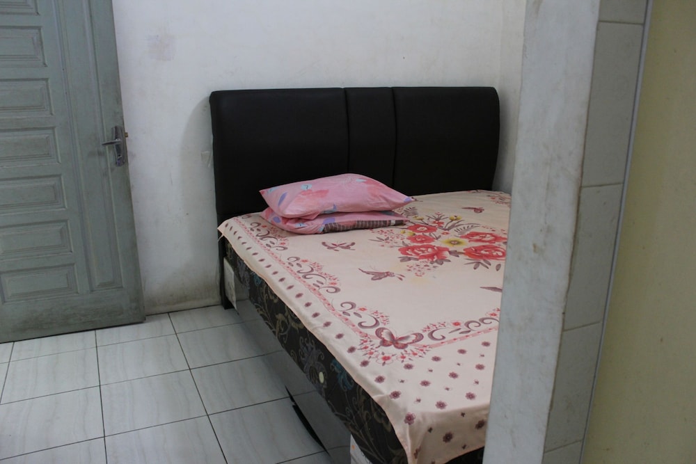 penginapan transit tomato