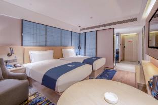 echarm hotel wuzhou mengshan coach station