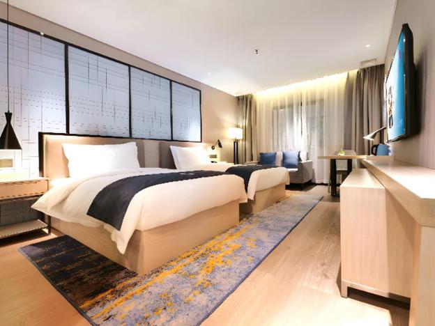 echarm hotel kunming haitun road economic management college