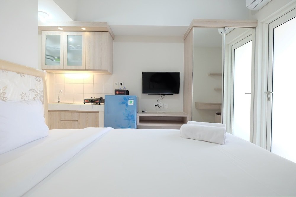 minimalist studio room at the springlake apartment sumarecon bekasi