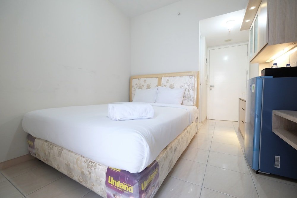 minimalist studio room at the springlake apartment sumarecon bekasi