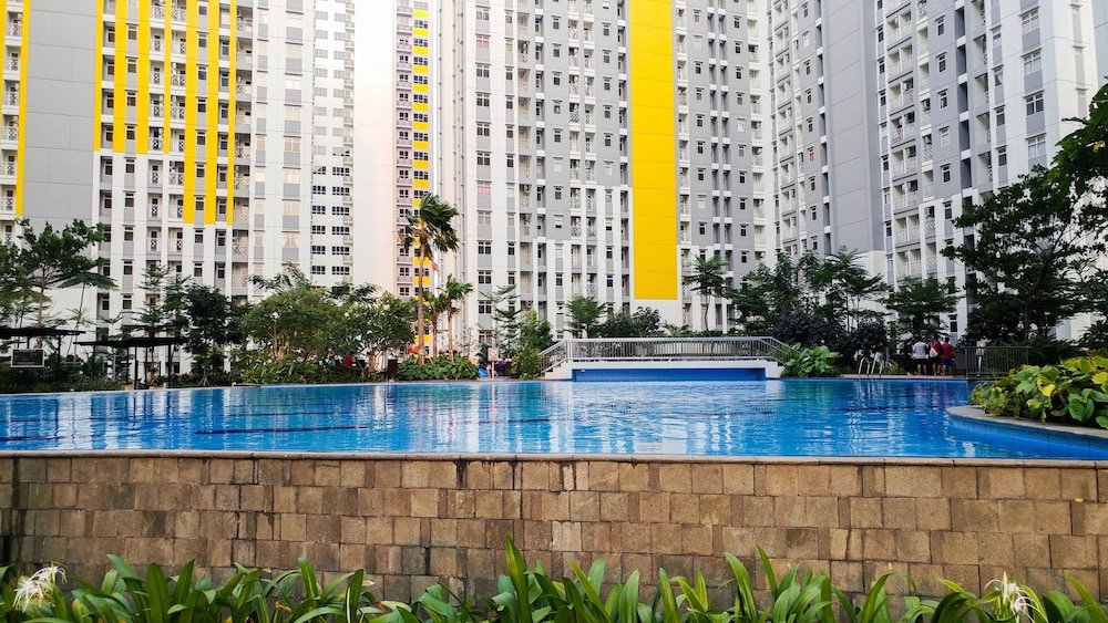 minimalist studio room at the springlake apartment sumarecon bekasi