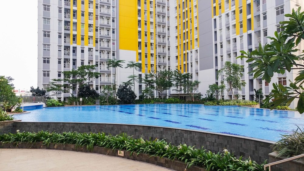 minimalist studio room at the springlake apartment sumarecon bekasi