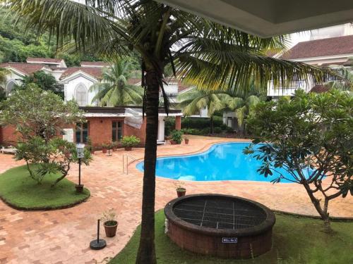 pool facing apartment in riviera foothills near baga arpoara