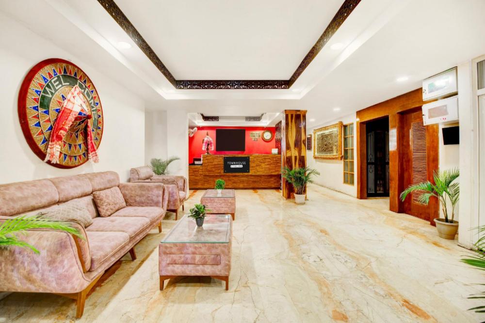 super townhouse hatigaon near medicity formerly hotel grand majesty