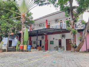 rumah panggung guest house syariah mitra reddoorz