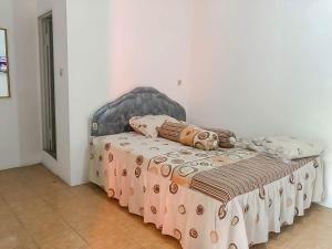 rumah panggung guest house syariah mitra reddoorz