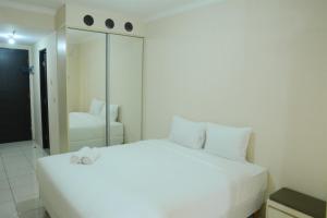 simply studio room at grand serpong apartment by travelio