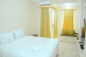 simply studio room at grand serpong apartment by travelio