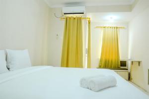 simply studio room at grand serpong apartment by travelio