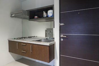 classic modern studio room apartment at the square surabaya