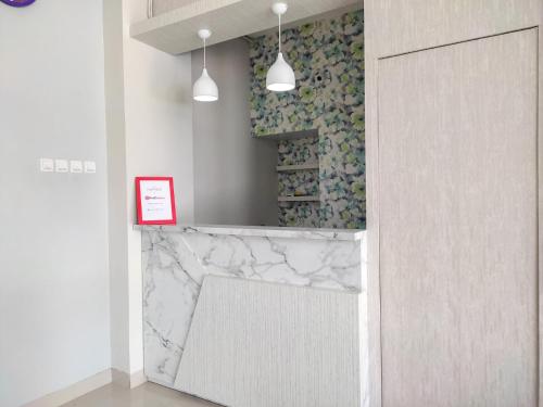 reddoorz syariah near gor satria area