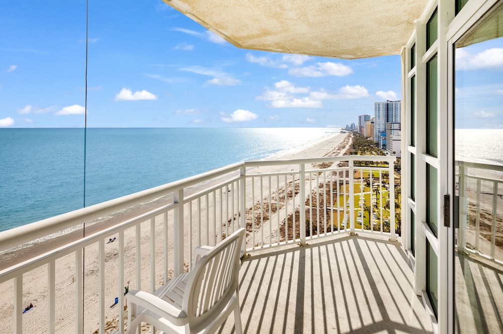 stunning condo with wall to wall windows overlooking ocean