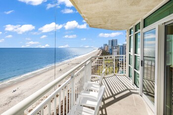 stunning condo with wall to wall windows overlooking ocean