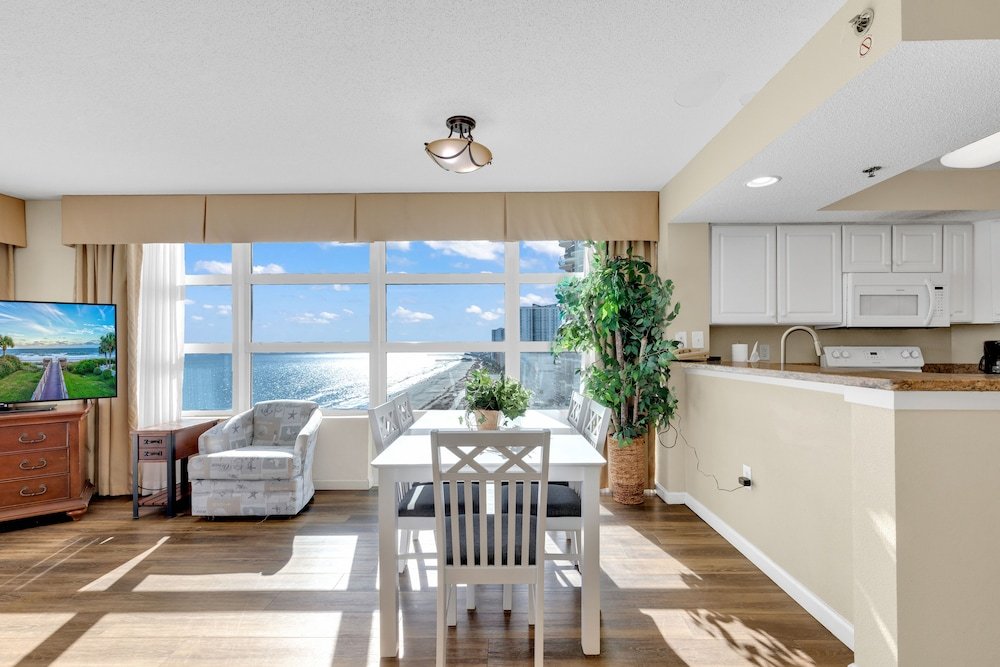 stunning condo with wall to wall windows overlooking ocean