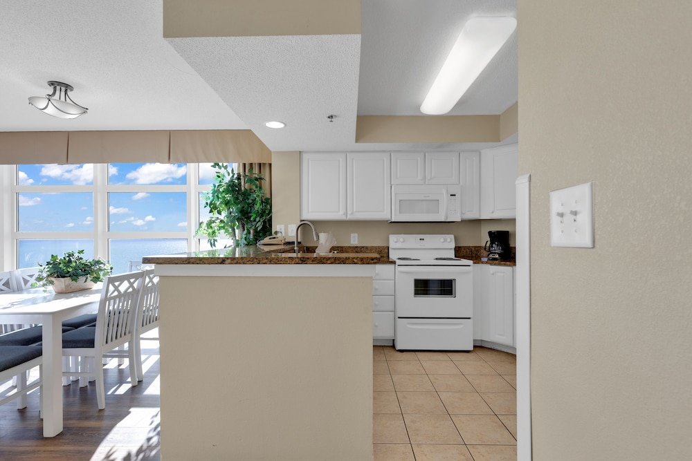 stunning condo with wall to wall windows overlooking ocean