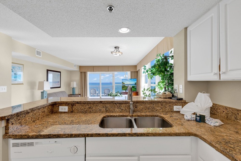 stunning condo with wall to wall windows overlooking ocean