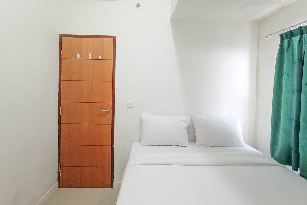 nice and homey 2br at vida view makasar apartment
