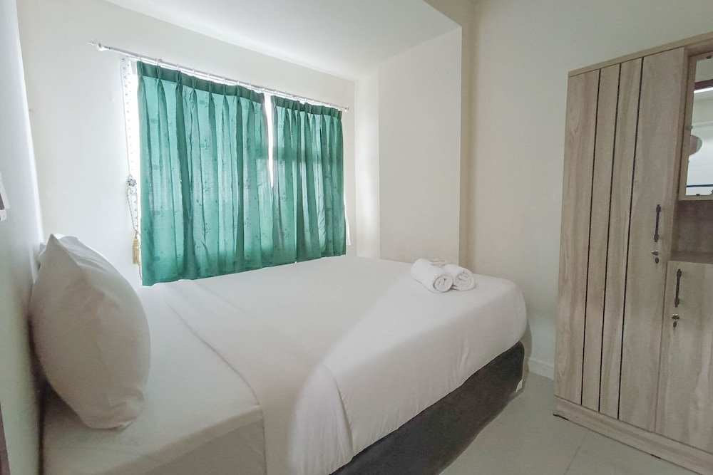 nice and homey 2br at vida view makasar apartment