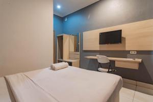 reddoorz hotel arimbi dewi sartika baru