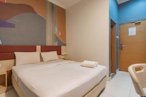 reddoorz hotel arimbi dewi sartika baru