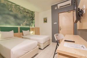 reddoorz hotel arimbi dewi sartika baru