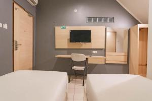 reddoorz hotel arimbi dewi sartika baru