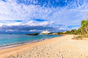 mr kinjo in front of manza beach