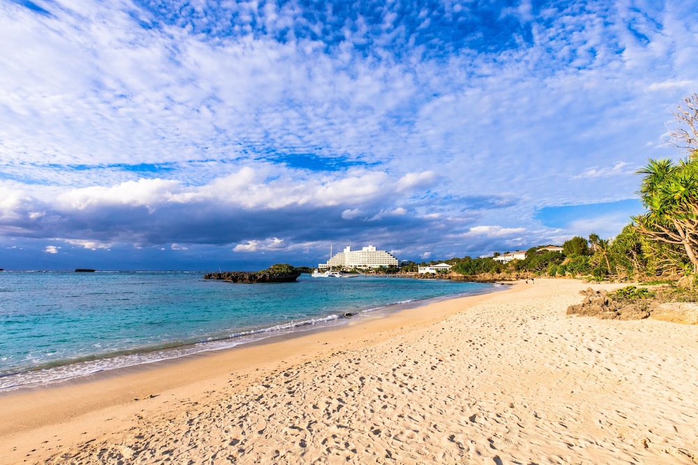mr kinjo in front of manza beach