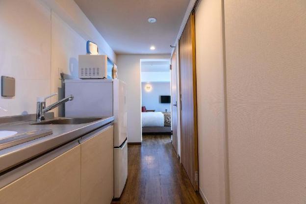 mr kinjo in front of manza beach