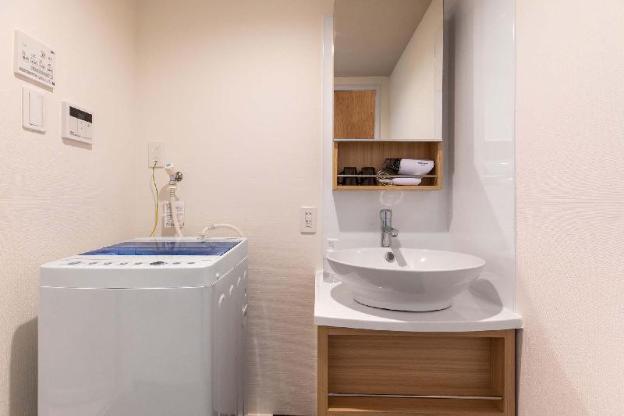 mr kinjo in front of manza beach