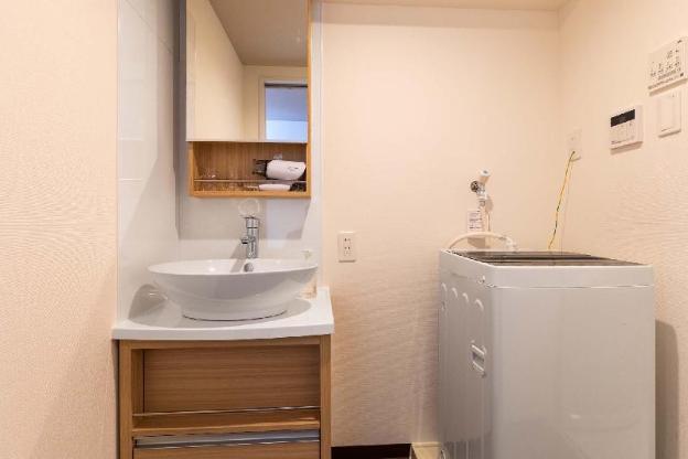 mr kinjo in front of manza beach