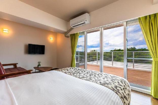 mr kinjo in front of manza beach