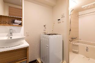 mr kinjo in front of manza beach