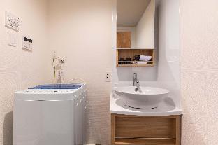 mr kinjo in front of manza beach