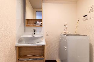 mr kinjo in front of manza beach