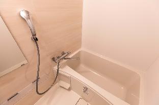 mr kinjo in front of manza beach