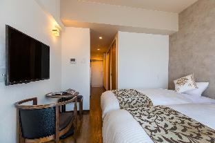 mr kinjo in front of manza beach